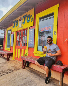 man in waimea shop with shave ice
